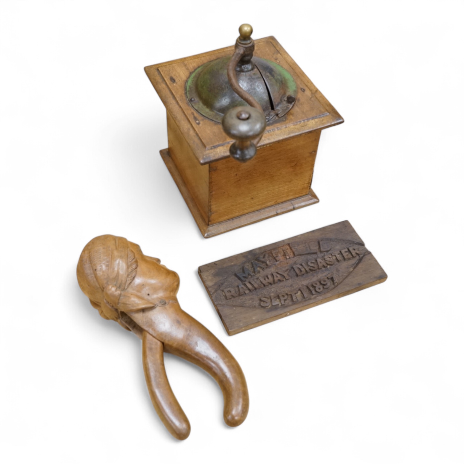 A coffee grinder, a figural nut cracker, two walking sticks, one mother of pearl inlaid and a railway sign